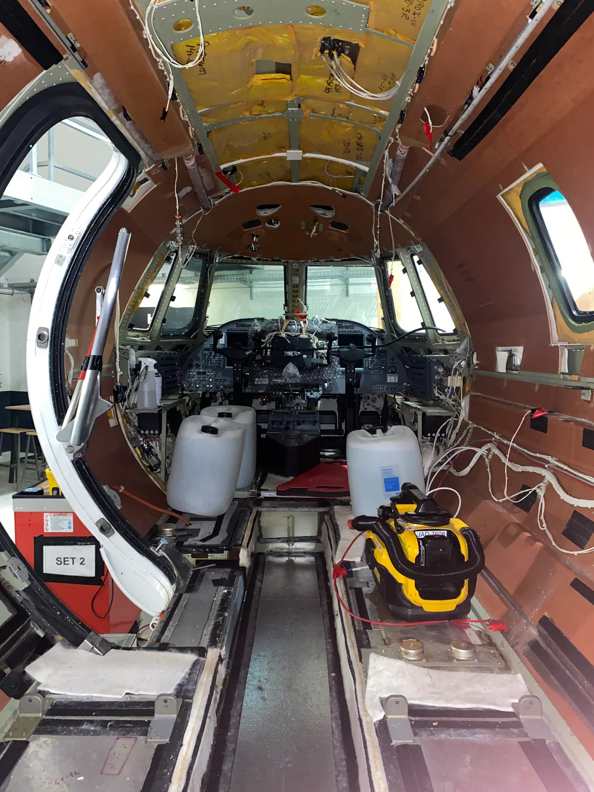 During the work: a view towards the cockpit through the stripped cabin.