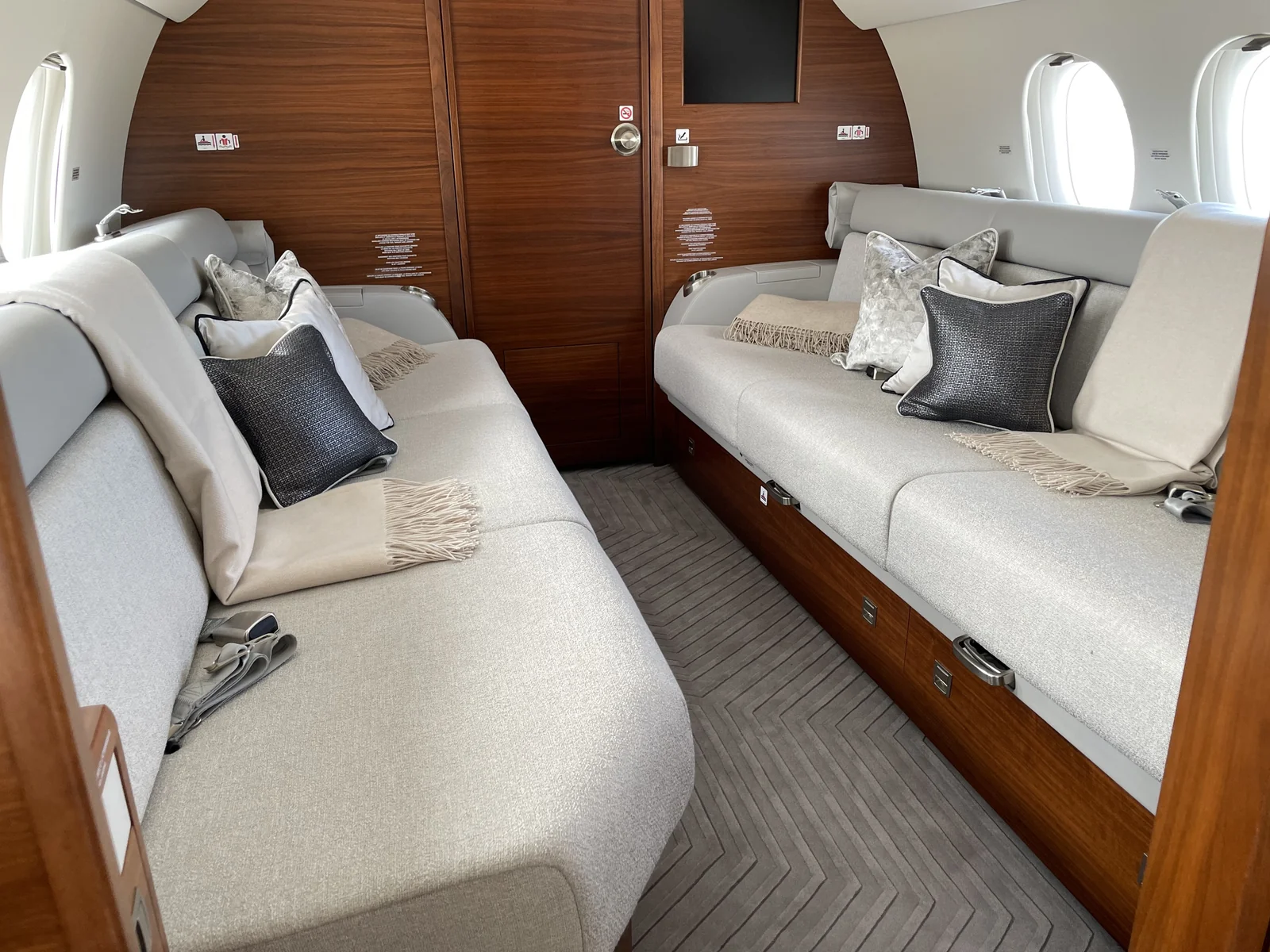 After: the rear lounge with new fabrics and colour-coordinated seat belts.