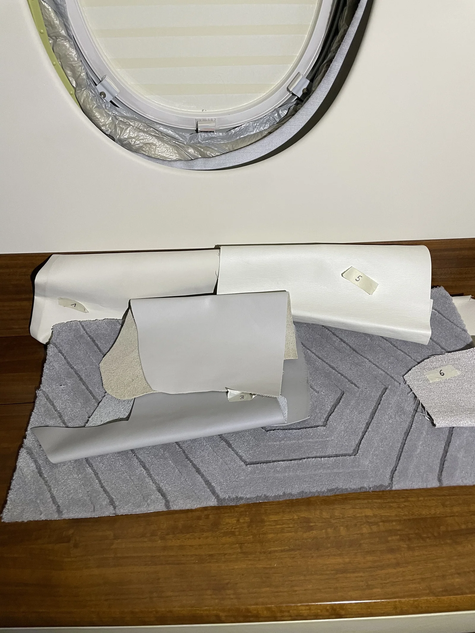 During selection: material and carpet samples considered alongside the existing wood.